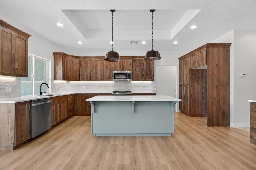 Custom kitchen with island and wood cabinetry
